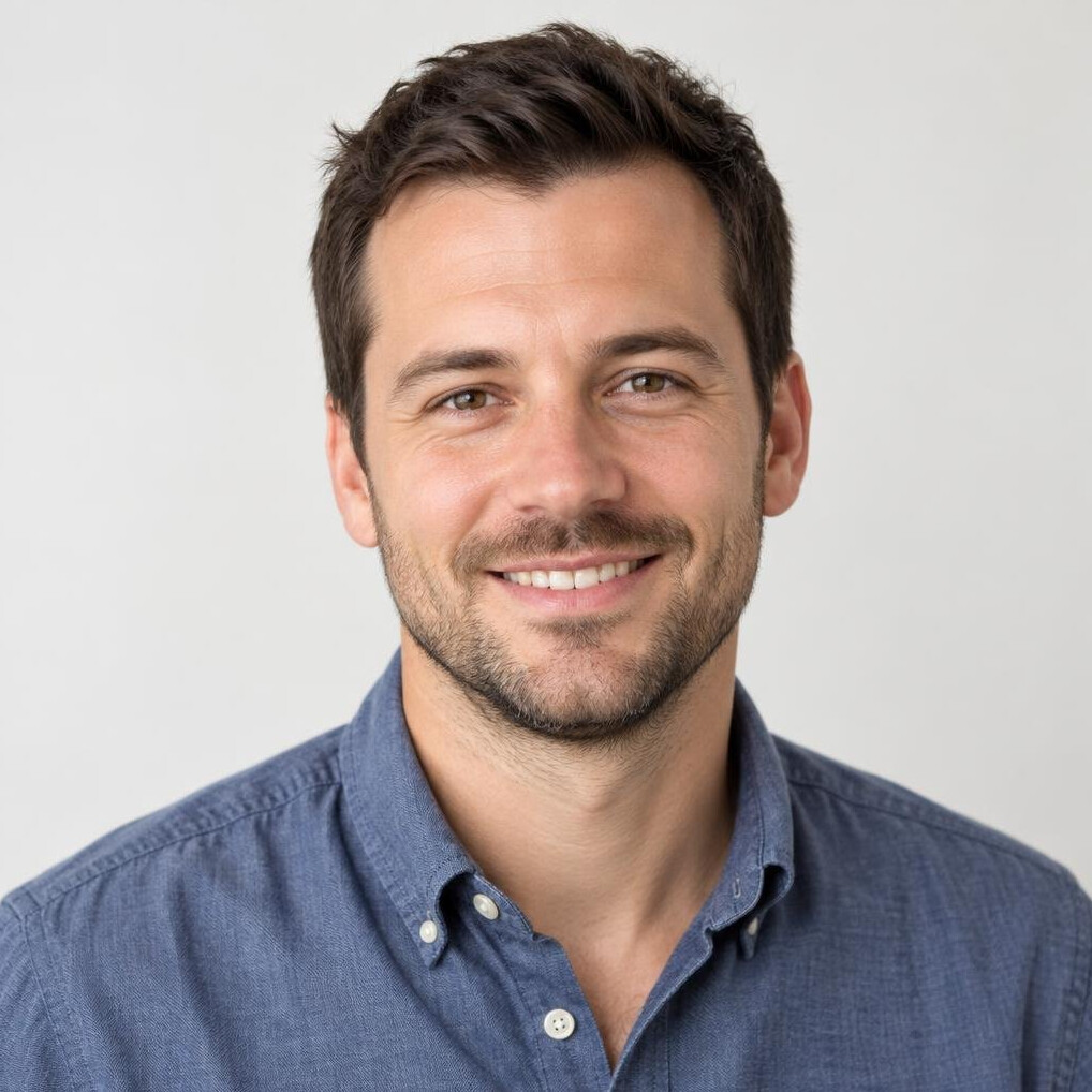 Portrait of a friendly man with short dark hair and a light beard